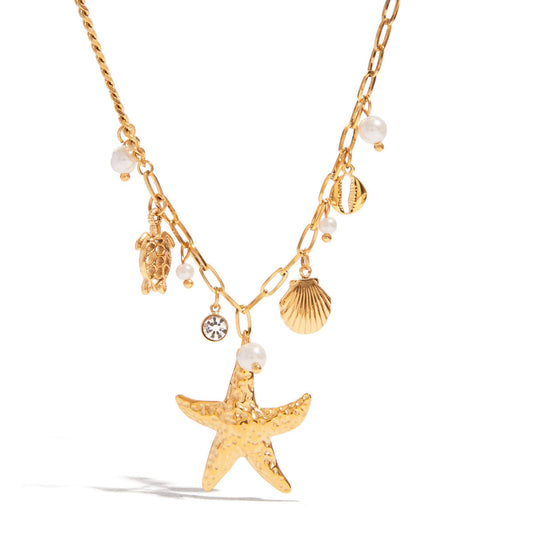 Gold necklace with starfish, shell, and pearl charms