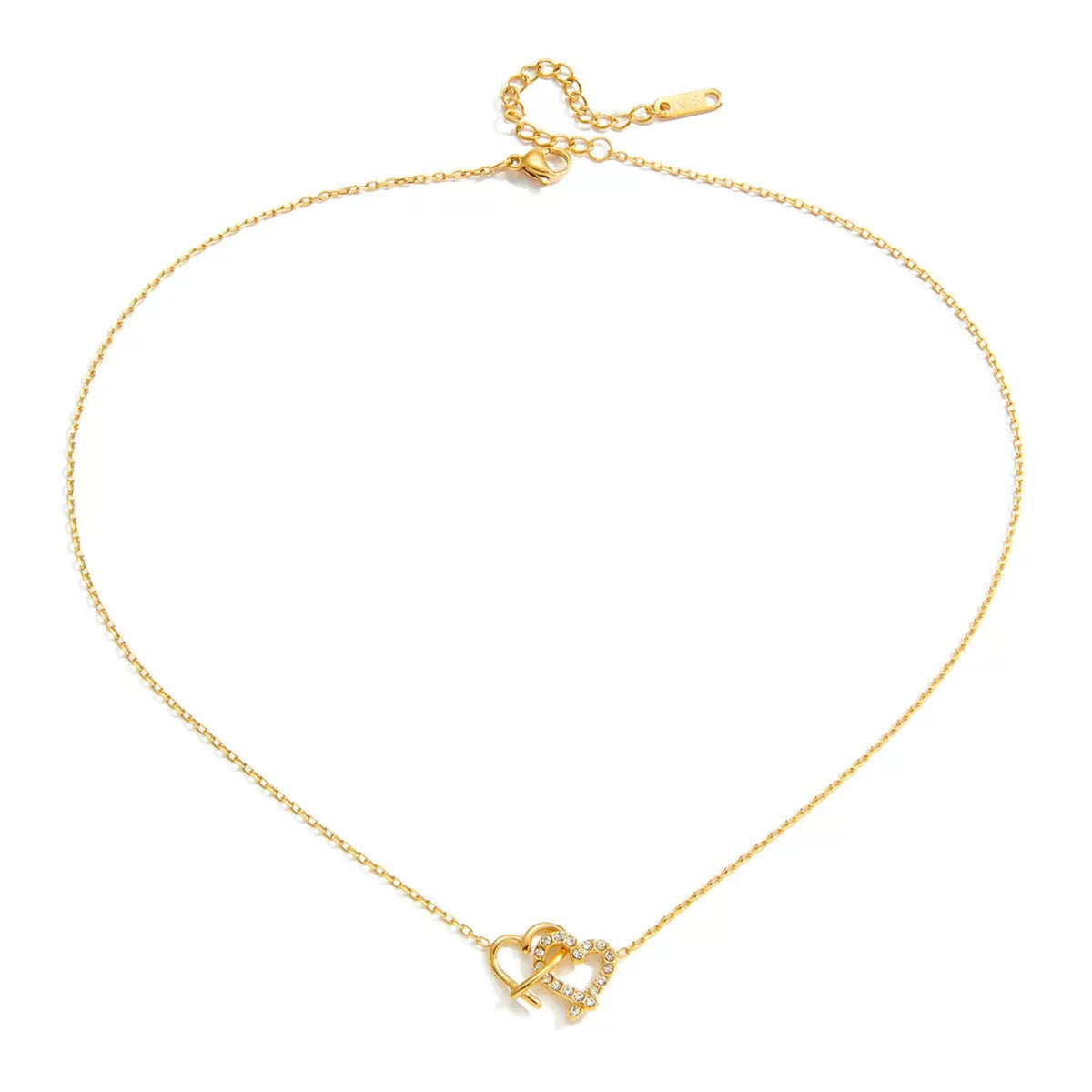 A delicate gold chain necklace featuring a small interlocking heart and anchor pendant adorned with tiny clear stones, displayed on a clean white background.