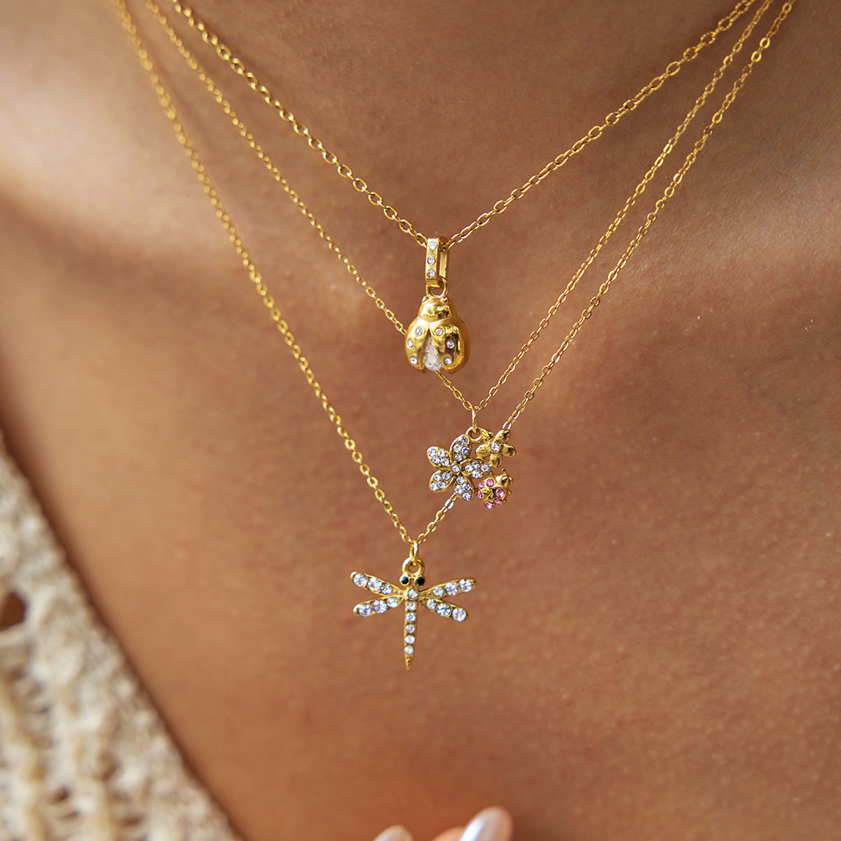 Layered Gold Necklaces with Dragonfly and Floral Pendants