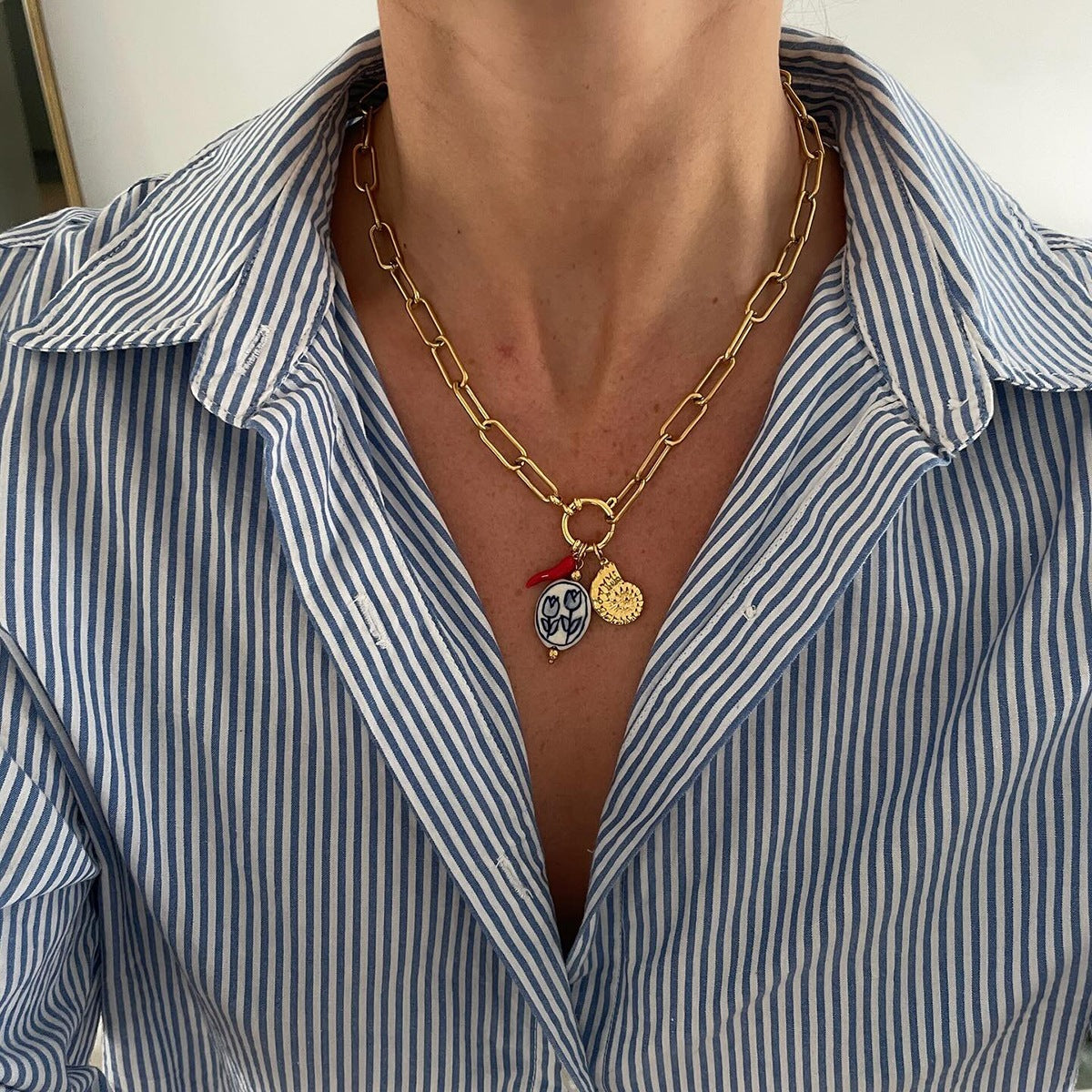 Multi - Layered Gold Necklace with Pearl and Charm Details