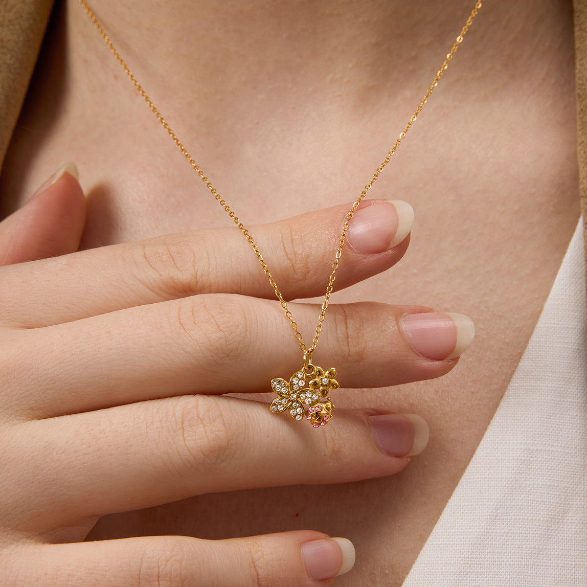 Layered Gold Necklaces with Dragonfly and Floral Pendants