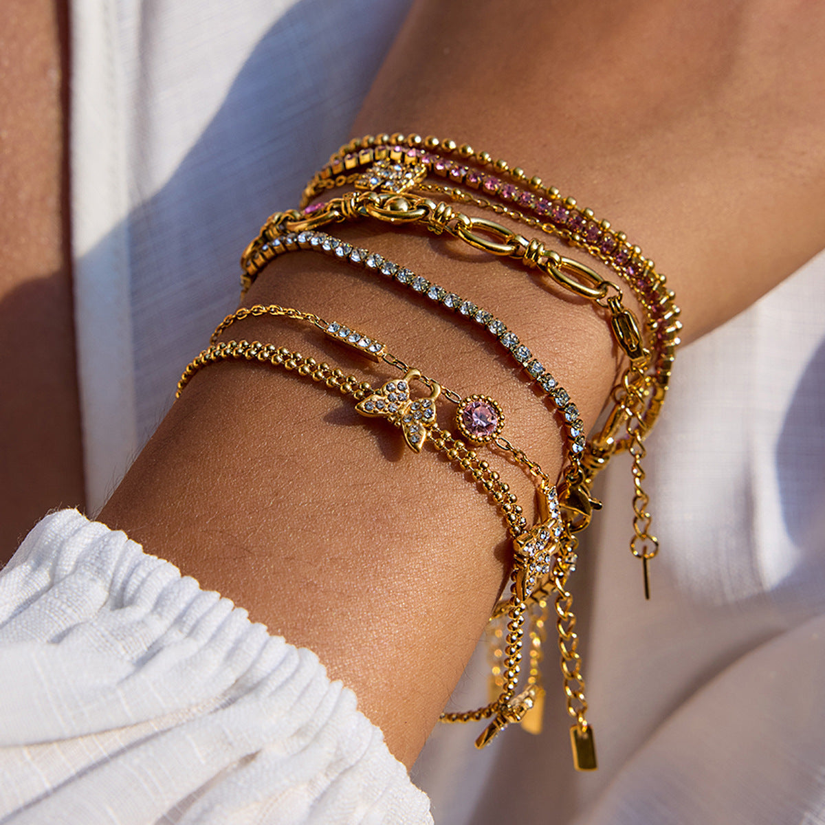 Gold Layered Bracelet Set with Butterfly, Pink Gemstones & Crown Charm