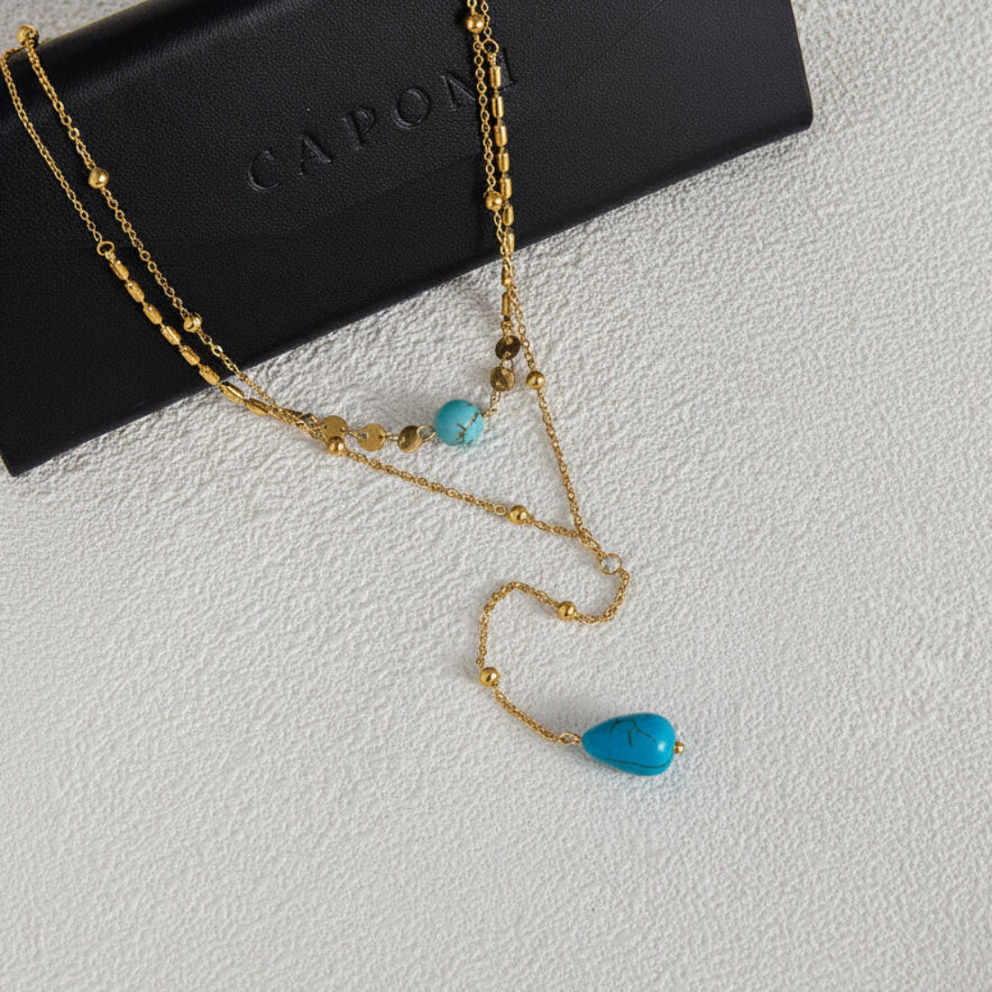 Gold necklace with blue stones