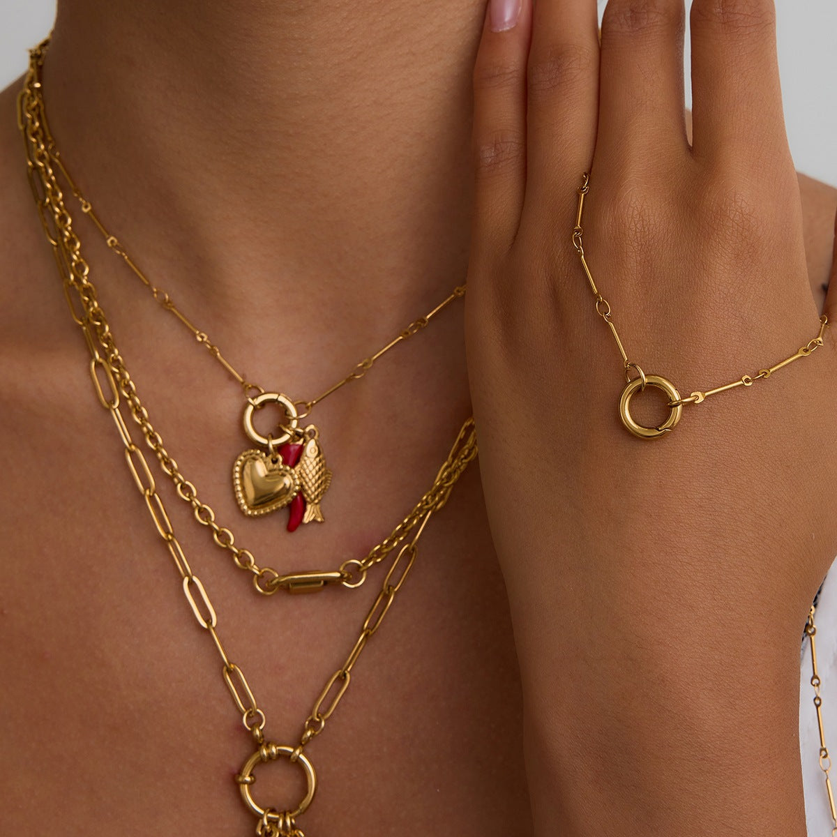 Multi - Layered Gold Necklace with Pearl and Charm Details