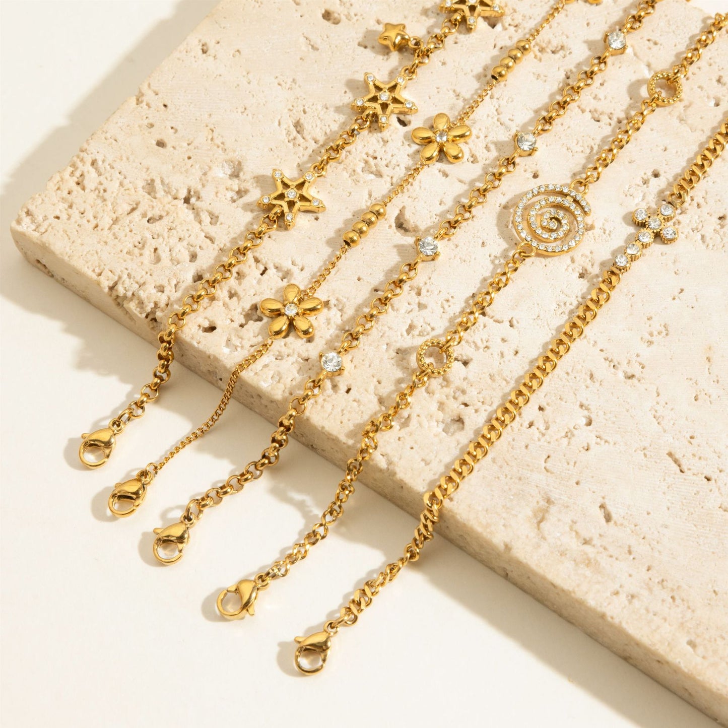 Layered Bracelet Set with Stars, Spiral Pendant, Cross Charms & Flower Charm