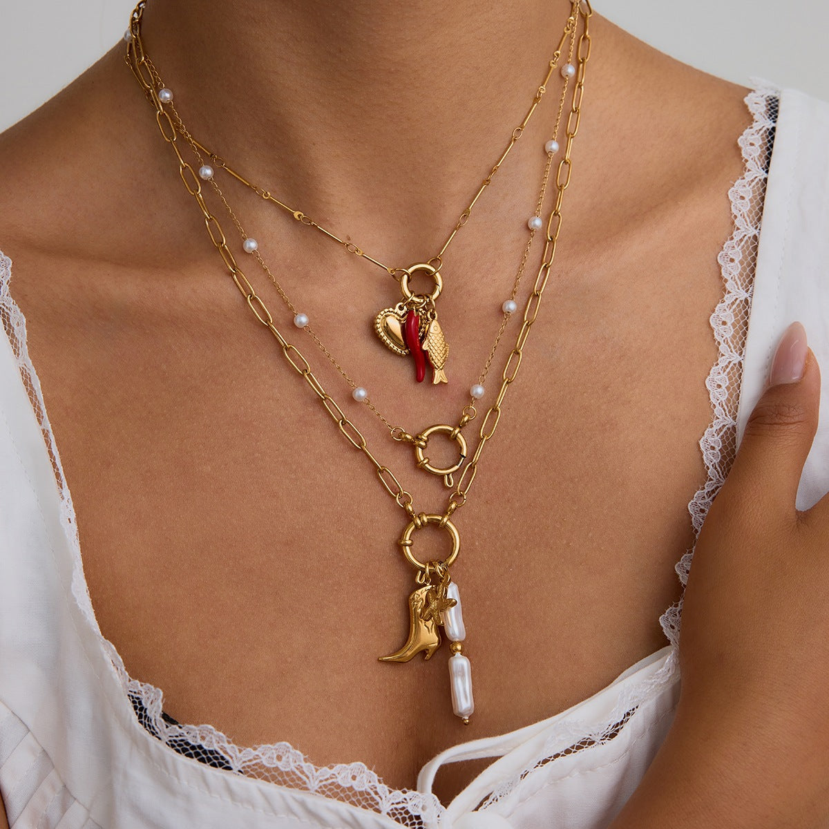 Multi - Layered Gold Necklace with Pearl and Charm Details
