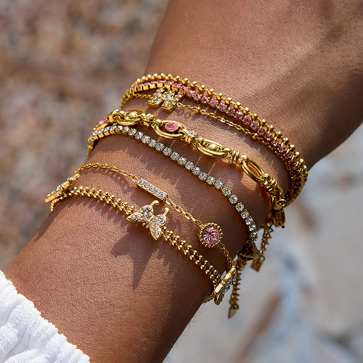 Gold Layered Bracelet Set with Butterfly, Pink Gemstones & Crown Charm