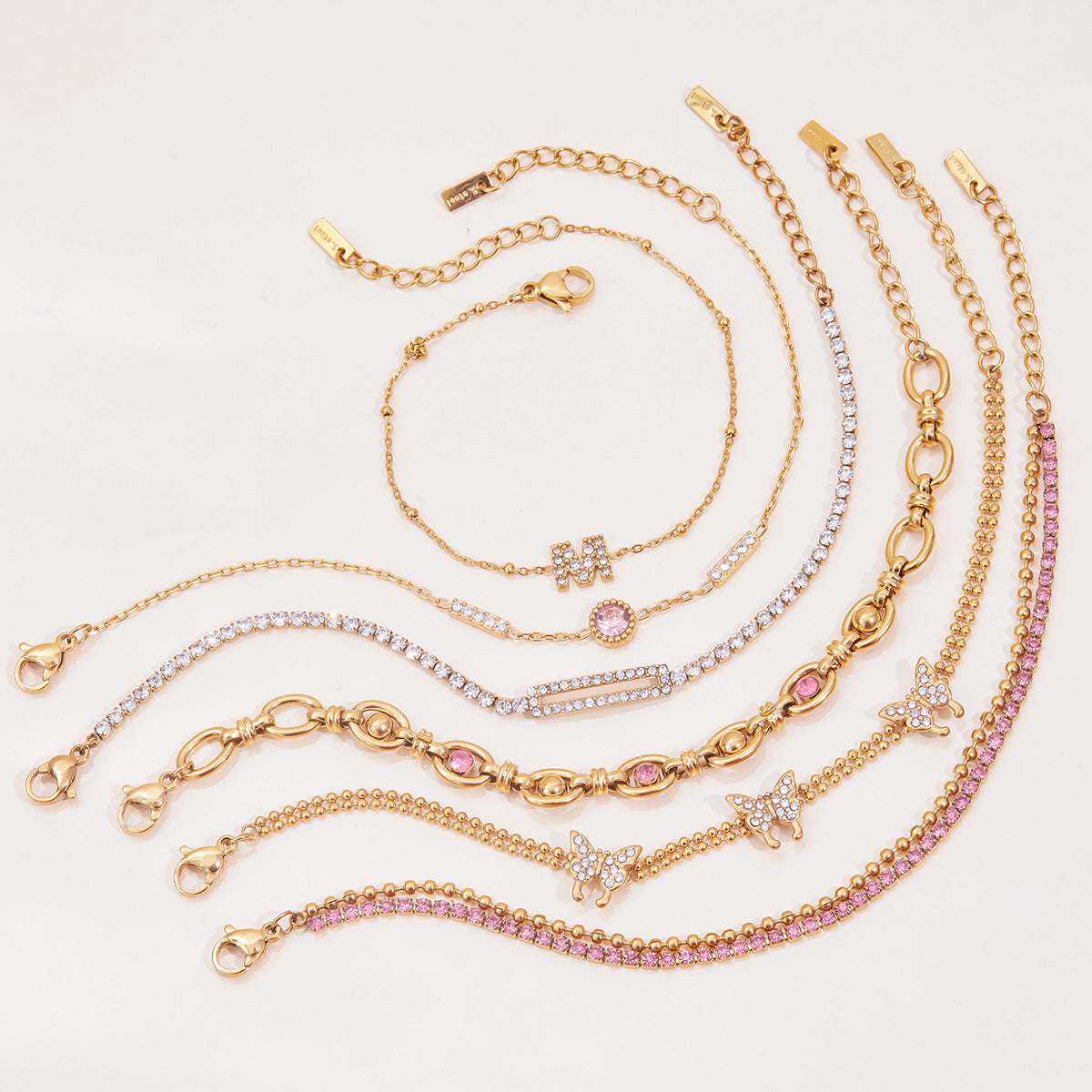 Gold Layered Bracelet Set with Butterfly, Pink Gemstones & Crown Charm