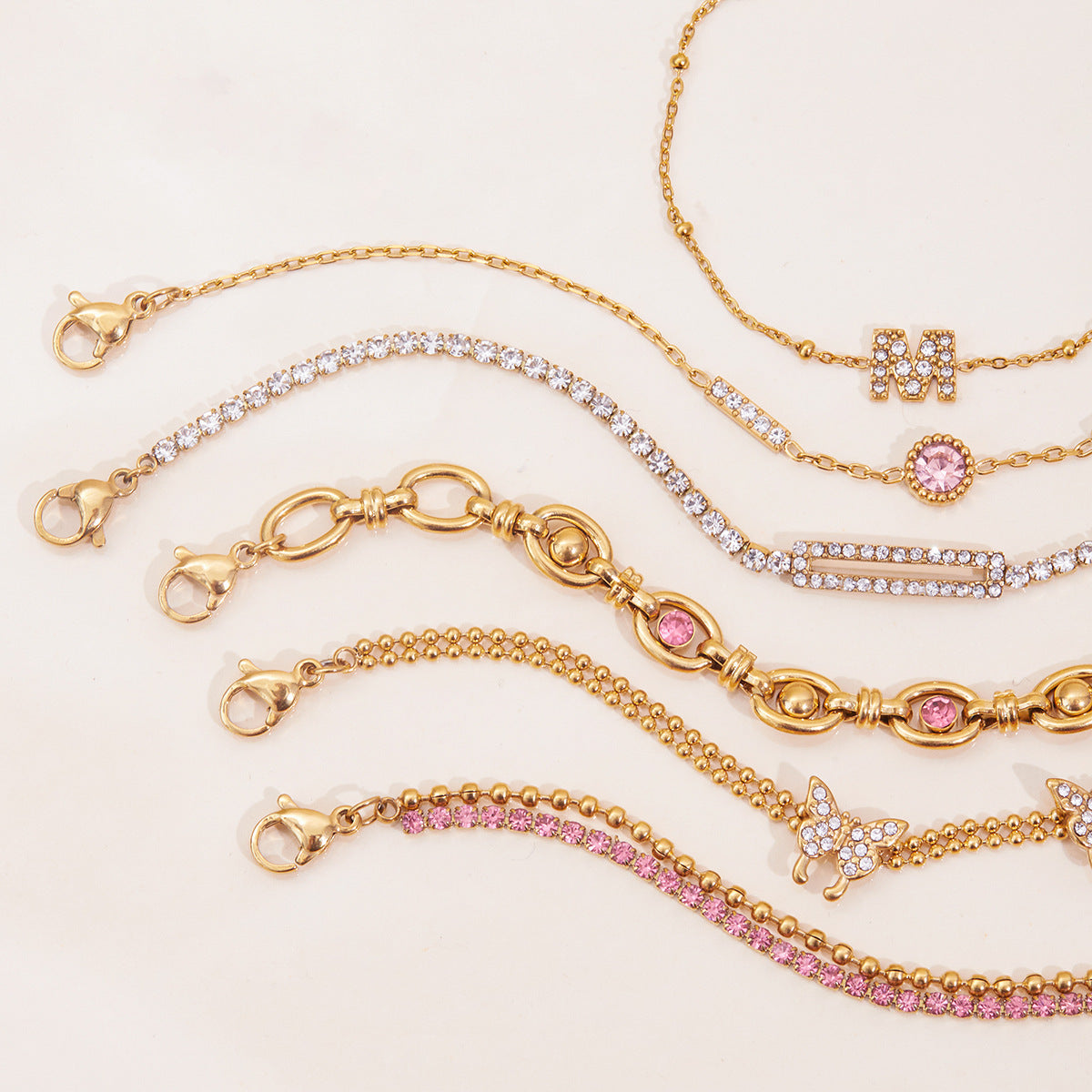 Gold Layered Bracelet Set with Butterfly, Pink Gemstones & Crown Charm