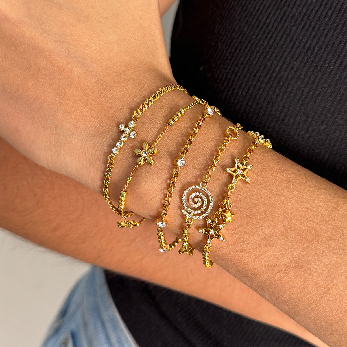 Layered Bracelet Set with Stars, Spiral Pendant, Cross Charms & Flower Charm
