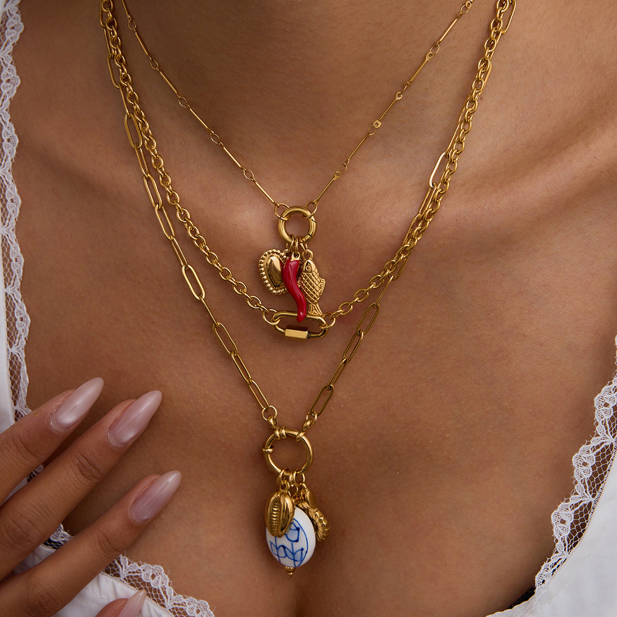 Multi - Layered Gold Necklace with Pearl and Charm Details