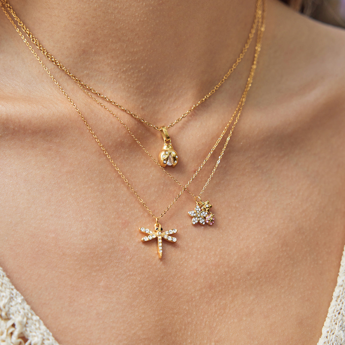 Layered Gold Necklaces with Dragonfly and Floral Pendants