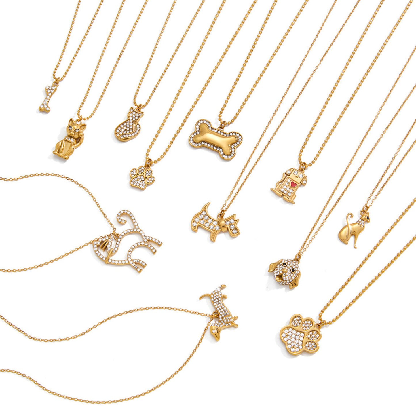 Collection of gold necklaces with various pendants on a white background