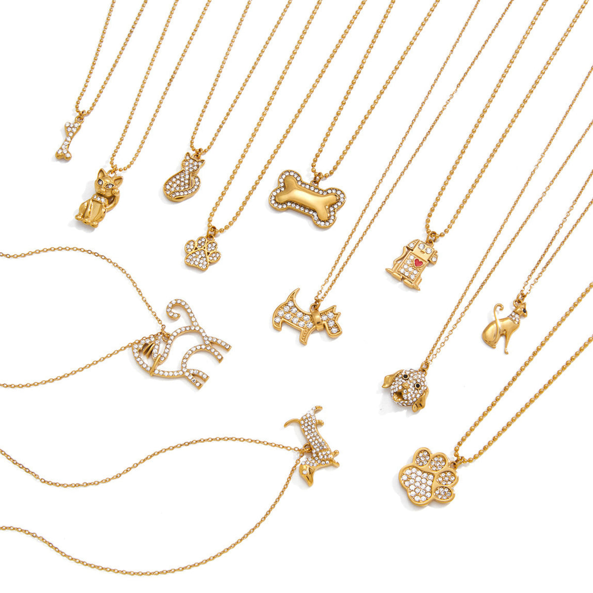 Collection of gold necklaces with various pendants on a white background