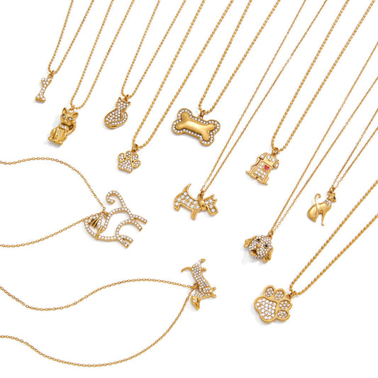 Collection of gold necklaces with various pendants on a white background